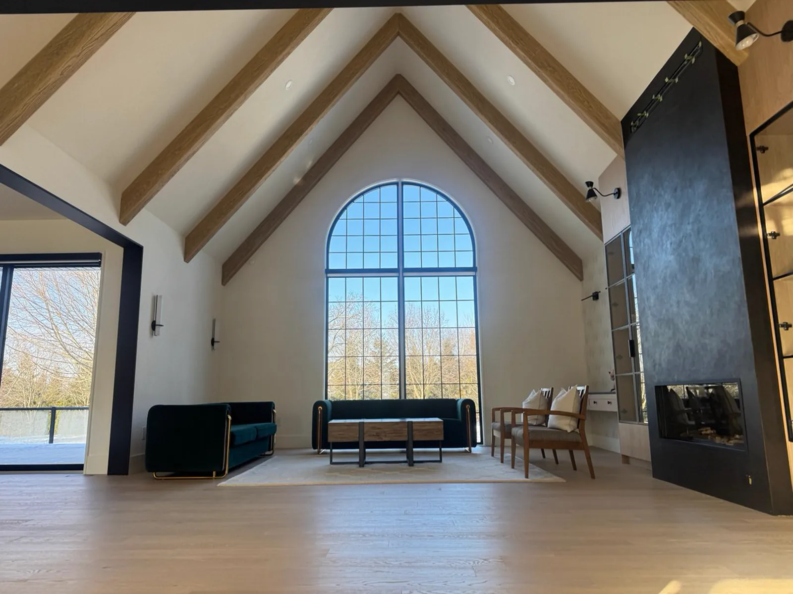Rushworth arched window living space with Venetian plaster fireplace